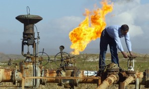 (FILES) -- File picture dated January 19, 2004 shows a worker turning a valve at the Shirawa oil field, where oil was first pumped in Iraq in 1927, outside the northern city of Kirkuk. No companies submitted bids to work on the Baghdad East oil field or the cluster of fields known as Eastern Fields as part of an Iraqi auction of its energy resources on December 11, 2009, Oil Minister Hussein al-Shahristani said. Meanwhile, Iraq reached agreement with energy giants Shell and Petronas for the massive Majnoon southern oil field, while a consortium led by China's CNPC was awarded the contract for Iraq's Halfaya oil field at an auction in Baghdad, the oil minister said. AFP PHOTO/Karim SAHIB